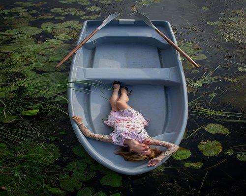 Person stretching gently in a living room in Thailand
