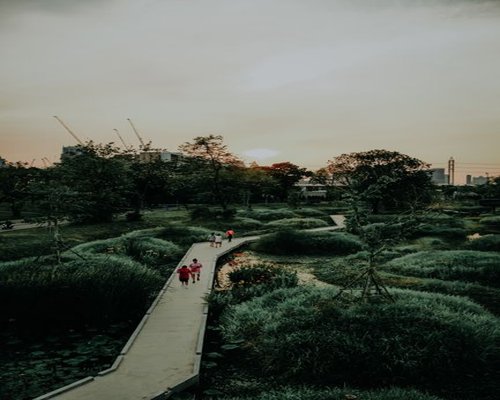 Team members walking in a park in Bangkok